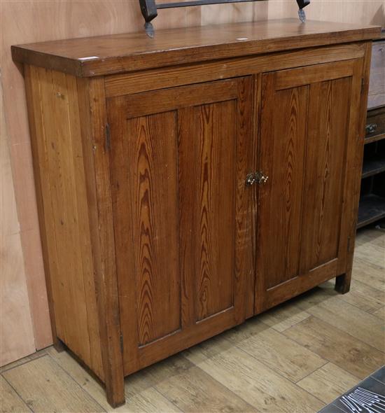 A pitch pine two door cupboard W.128cm